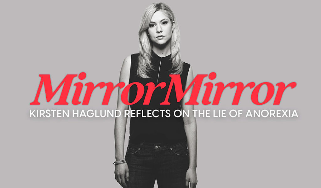 A black and while photo of Kristen Haglund standing with arms at her side.