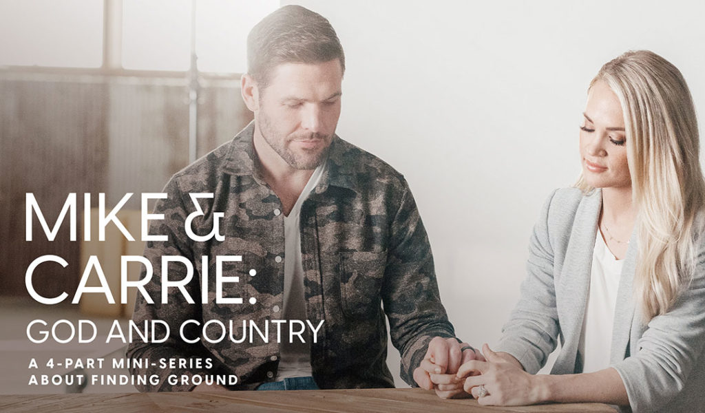 Mike Fisher and Carrie Underwood holding hands while sitting at a table.