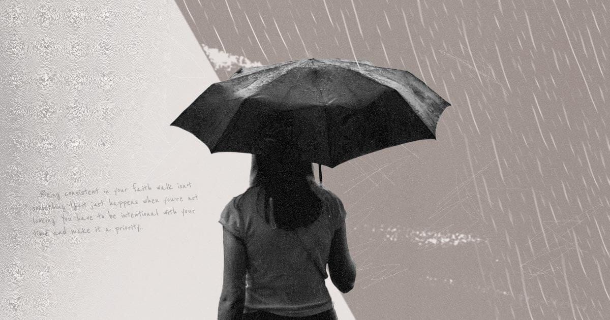 A black and white image of a woman standing with her back to the camera holding an umbrella in the rain.